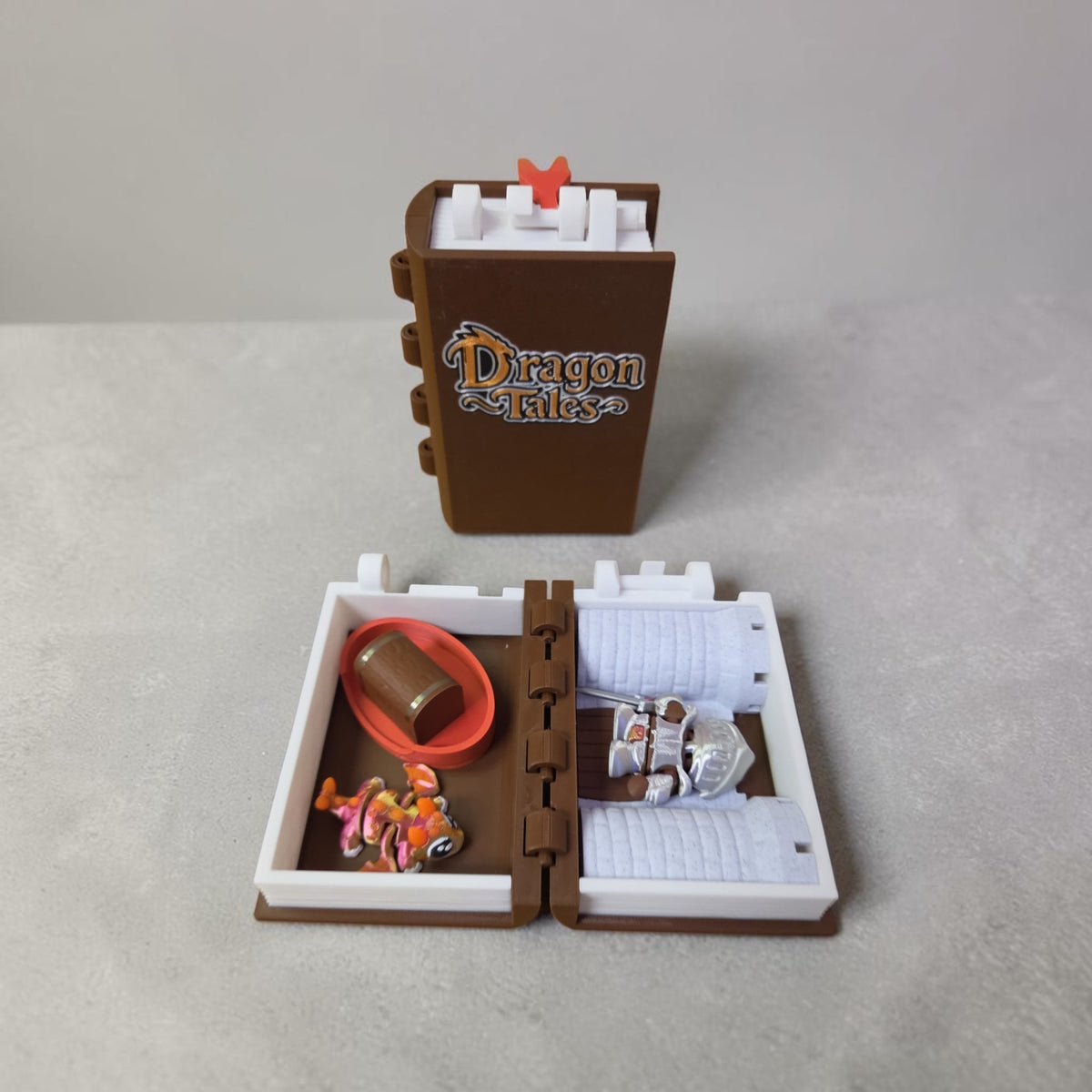HPHobbies Dragon Tales adventure book playset with miniature dragon, knight, treasure, and castle inside a book box.
