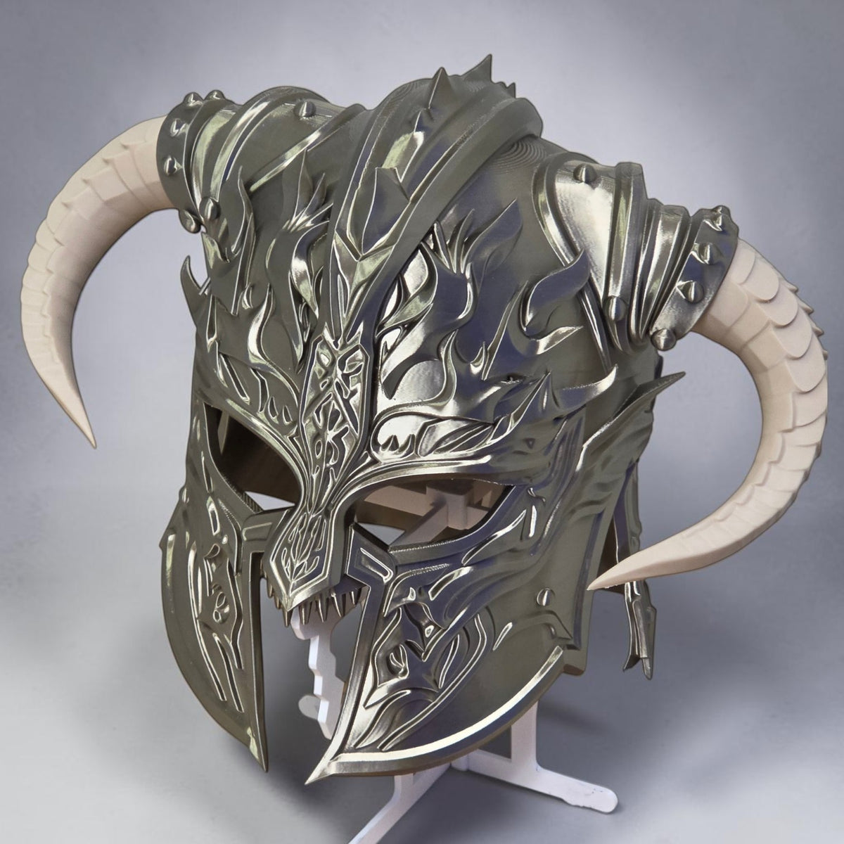 HPHobbies metallic silver Viking helmet with intricate embossed patterns and large curved cream-colored horns