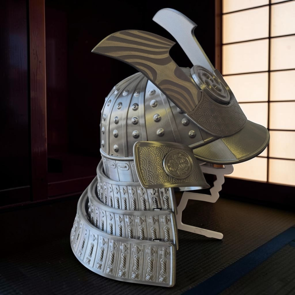 HPHobbies traditional Japanese Samurai Kabuto helmet replica in metallic silver with intricate embossed wave patterns.
