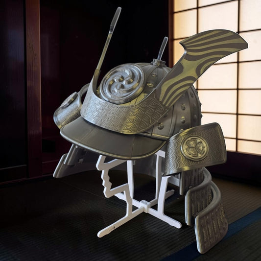 HPHobbies metallic silver Japanese Samurai Kabuto helmet replica with intricate embossed wave patterns on display stand.