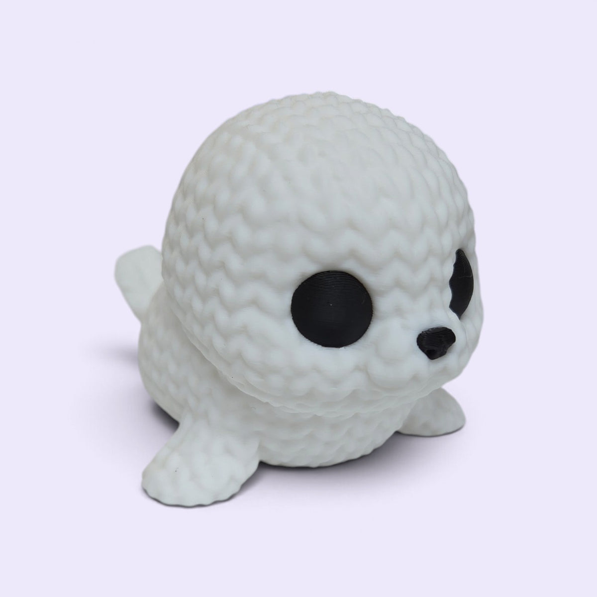 HPHobbies white 3D printed faux knit seal figurine with black eyes and nose, resembling a crochet plush toy.
